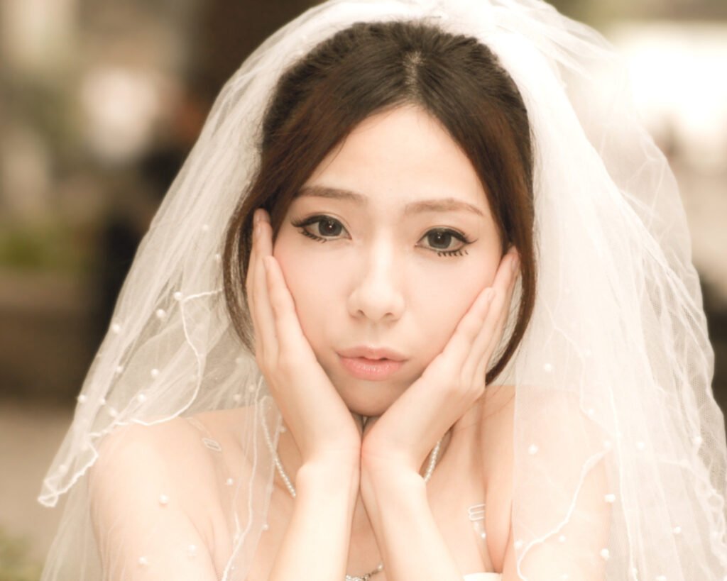 Gallery photo - Asian bride holding face with two hands